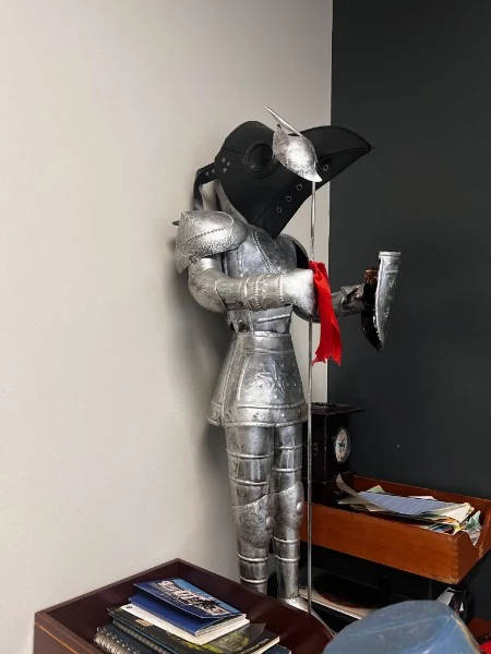 Sir Southeast wearing a plague mask.