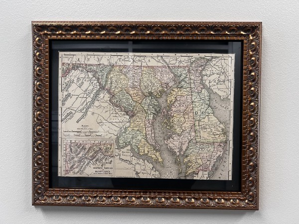 Ornately framed map of Maryland and Delaware showing Chesapeake Bay and county boundaries.