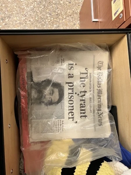 A Dallas Morning News front page with the headline “The tyrant is a prisoner.”