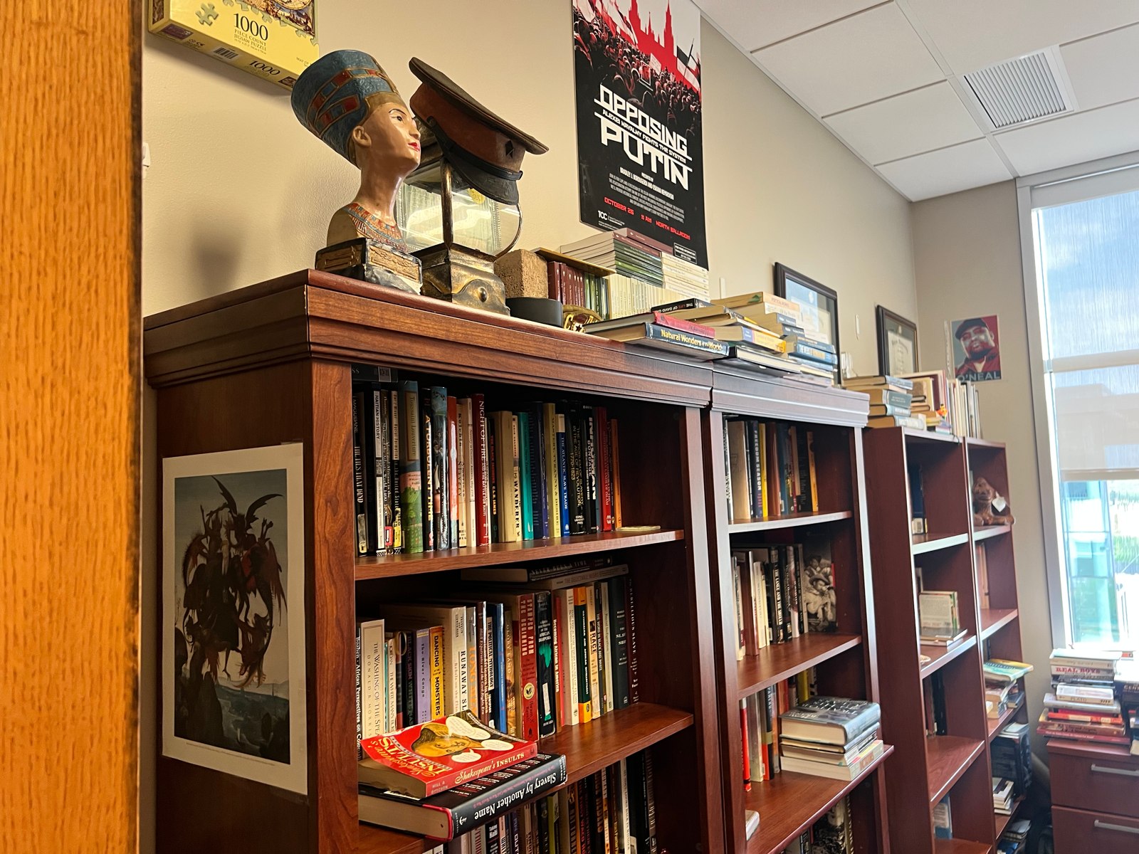 Bookshelves and objects on display inside the Center for History and Culture.