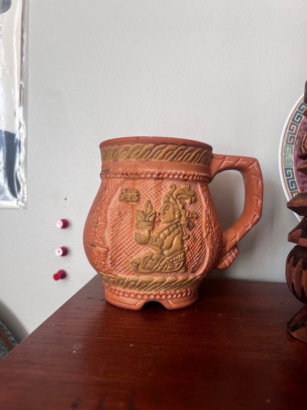 A decorated cup pictured on the original Center page under the label “Cacao Cup.”