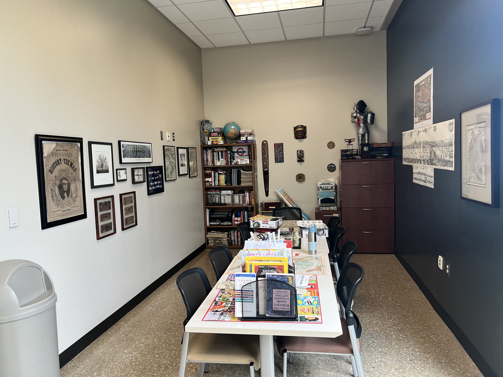 Tables, shelves, maps, and displays inside the Center for History and Culture.