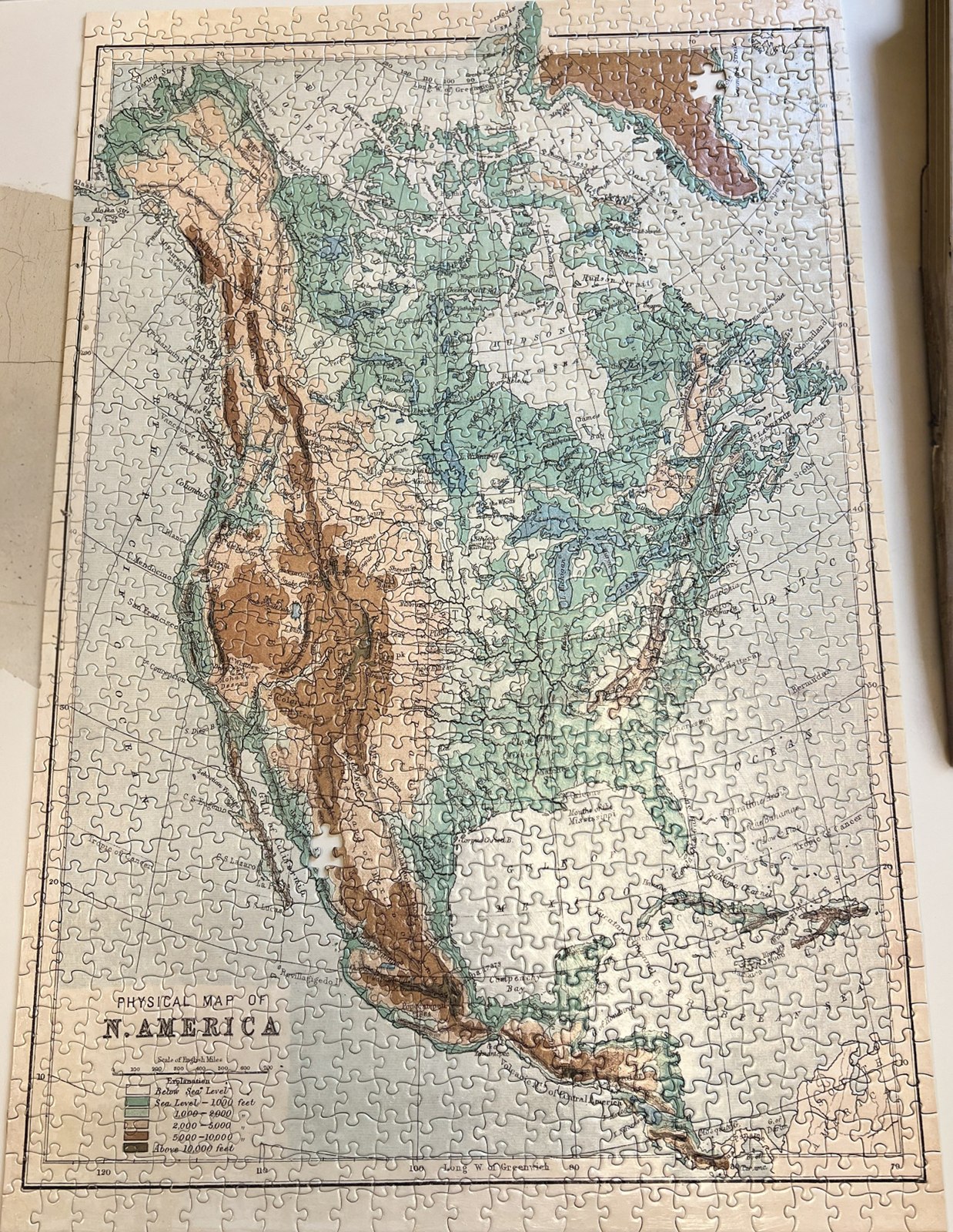 A framed puzzle depicting a map of North America.